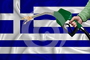 GREECE flag Close-up shot on waving background texture with Fuel pump nozzle in hand. The concept of design solutions. 3d