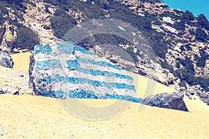 Greece flag painted on a rock 2