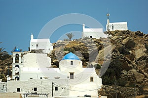 Greece the island of Ios.  Chapels atop a hill.