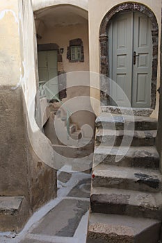 Greece, the island of Santorini. The inland village of Emborio. Doorways and steps.