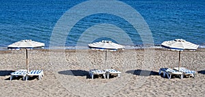 Greece. Kos island. Kefalos beach. Chairs and umbrellas photo