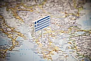 Greece marked with a flag on the map