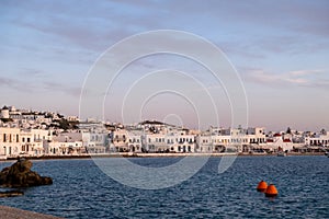 Greece, Mikonos island, Cyclades. Waterfront building, shop, sea, blue sky background photo