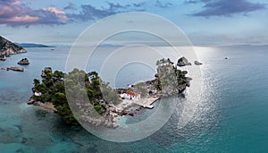 Greece Parga. Aerial drone view of Panagia island, small chapel and trees on the rock