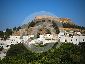 Greece. Rhodes. Acropolis of Lindos. Doric columns of ancient Temple of Athena Lindia the IV century BC and the bay of.