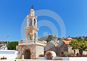Old stone Bell tower and Church of the Assumption of the Virgin Mary at Greek Asklipio village on Rhodes