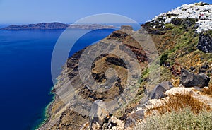 Greece, Santorini. Amazing view from famous sunset point on island in Aegean sea - Santorini over Oia - Ia village at the slope of photo