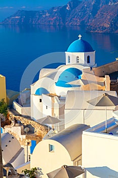 Greece, Santorini. White architecture and blue domes of Santorini against the backdrop of the sea