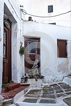 Greece, Serifos island. Traditional whitewashed building and paved alley at Chora town, Cyclades