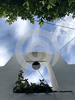 Greece is splendid with white bell towers, blue skies, and green plants