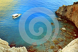 Greece summer coastline view. Blue sea water, mountain and boat