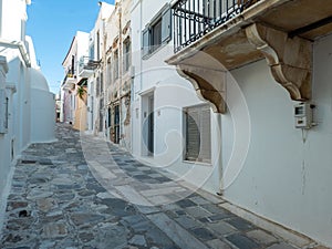 Greece Tinos island, Chora town, Cyclades. Whitewashed houses, cobblestone alleys, blue sky