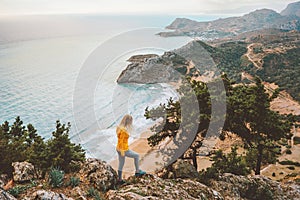 Greece vacations woman hiking in Rhodes island travel outdoor tourist sightseeing aerial Tsambika beach