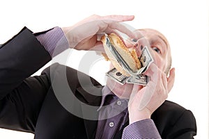 Greed avarice consuming dollars photo