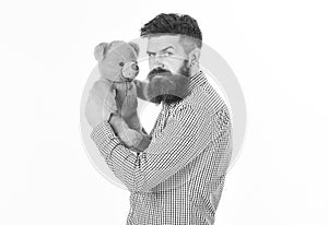 Greediness concept. Miserly hipster holds his toy. Guy with beard does not like to share soft toy.
