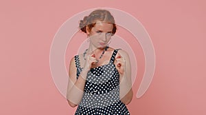 Greedy avaricious redhead young woman showing fig negative gesture, rapacious avaricious acquisitive photo