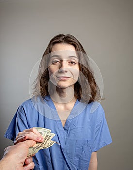 Greedy Doctor taking cash