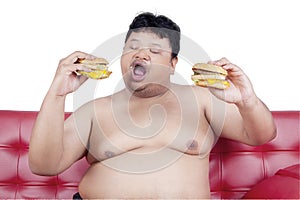 Greedy person enjoy two hamburger