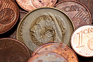 Greek 50 drachmas coin among euro coins