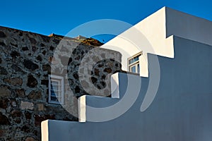 Greek architecture abstract background - whitewashed house with stairs. Milos island, Greece