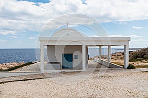 Greek Ayioi Anargiroi Church in Cyprus. A small Orthodox church on an island by the sea