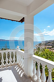 Greek balcony with balusters, sea view near Athens