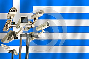 Greek CCTV camera on the flag of Greece Surveillance, security, control and totalitarianism concept