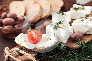Greek cheese feta with thyme and olives. selective focus, copy