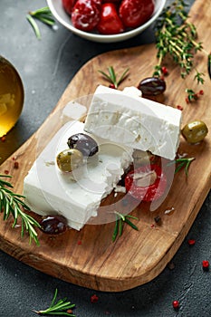 Greek cheese feta with thyme, rosemary, olives and stuffed red bell peppers