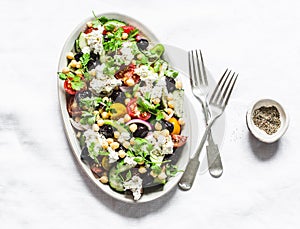 Greek chickpeas salad on light background, top view. Vegetarian healthy diet food