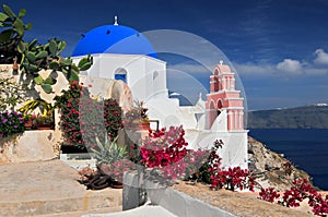 Greek church with blue dome and pink bell tower, Oia, Santorini Thira, Cyclades Islands, Greek Islands, Greece, Europe