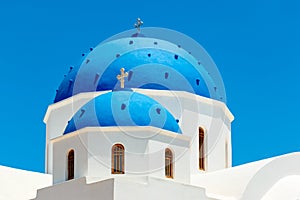 Greek church with blue dome in Santorini