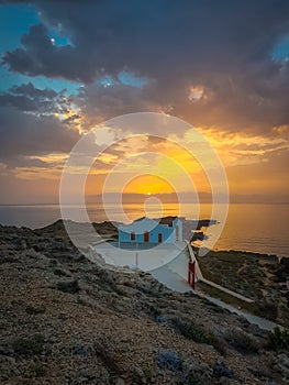 Greek church by the sea, sunrise or sunset. Landscape shot from the island of Zakyntos
