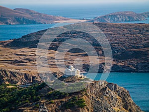 Greek church top on a hill, near ocean