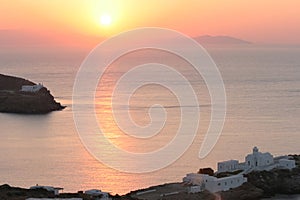Greek coast with old church at sunrise photo
