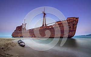 Greek coastline with the famous rusty shipwreck in Glyfada beach near Gytheio, Gythio Laconia Peloponnese.