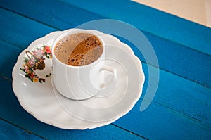 Greek coffee on a blue table photo