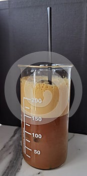 Greek coffee frape in test tube photo