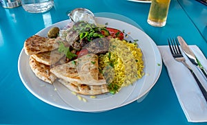 Greek dinner plate on blue table