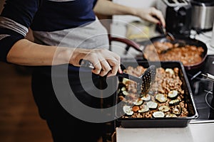 Greek dish in a baking tray standing on the stove