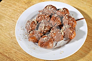 Greek donut with syrup and chocolate loukoumades