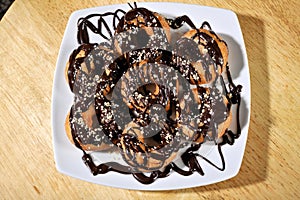 Greek donut with syrup and chocolate loukoumades