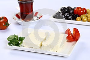 Greek feta cheese block on white.