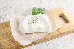 Greek Feta cheese over board