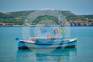 Greek fishing boat in Aegean sea near Milos island, Greece