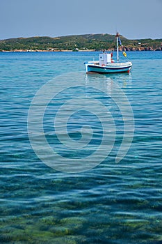 Greek fishing boat in Aegean sea near Milos island, Greece