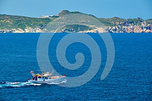 Greek fishing boat in Aegean sea near Milos island, Greece