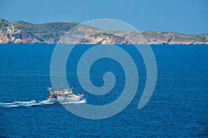 Greek fishing boat in Aegean sea near Milos island, Greece