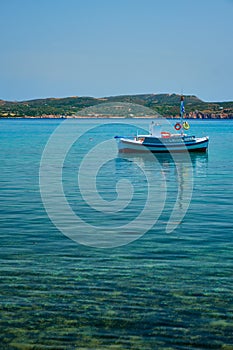 Greek fishing boat in Aegean sea near Milos island, Greece