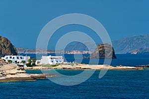 Greek fishing village with traditional whitewashed white houses on Milos island